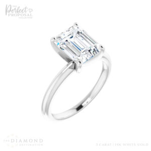 A captivating 3 carat emerald cut lab grown diamond engagement ring, showcasing timeless elegance and love.